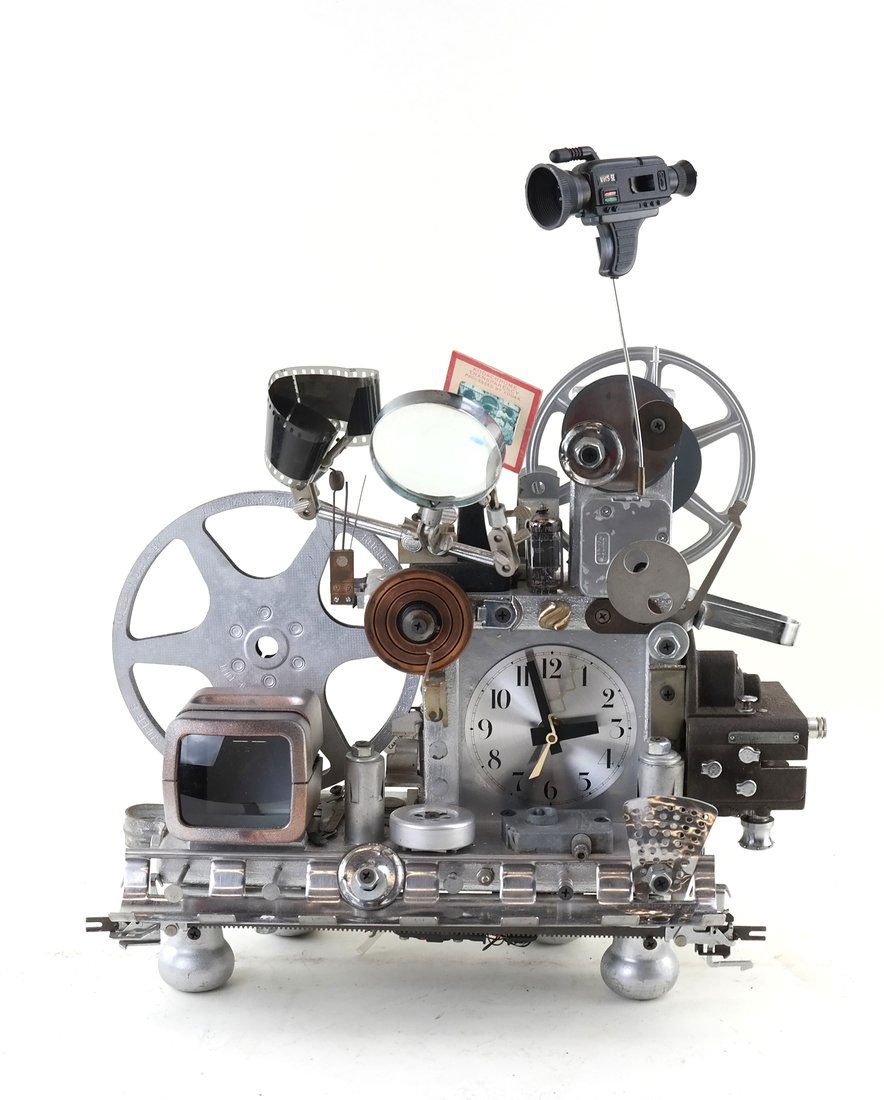 Original "Thomas Mann" Clock: 20th century American "Folk" art craft clock made from found parts. [18 1/4" H x 15 1/2" W x 6" D]. Clock appears to be in working condition. Sold as is.