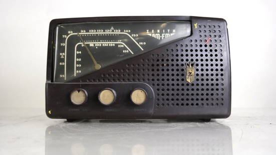 Zenith AM/FM Radio, Model L721: Modern plastic AM/FM tube radio with sloping dial face. Dimensions:12.00 " W x 7.00 " H x 8.00 "D;