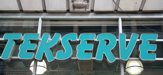 Tekserve Sign: Illuminated sign with Tekserve logo.