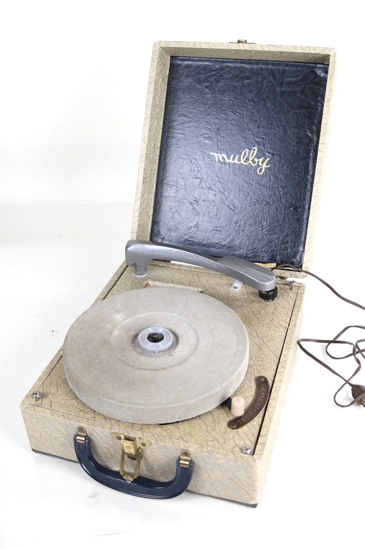 Mulby Travel Record Player: Mulby phonograph in travel case. Dimensions: 10.00 " W x 5.00 " H x 12.00 "D; None " W x None " H x None &quo