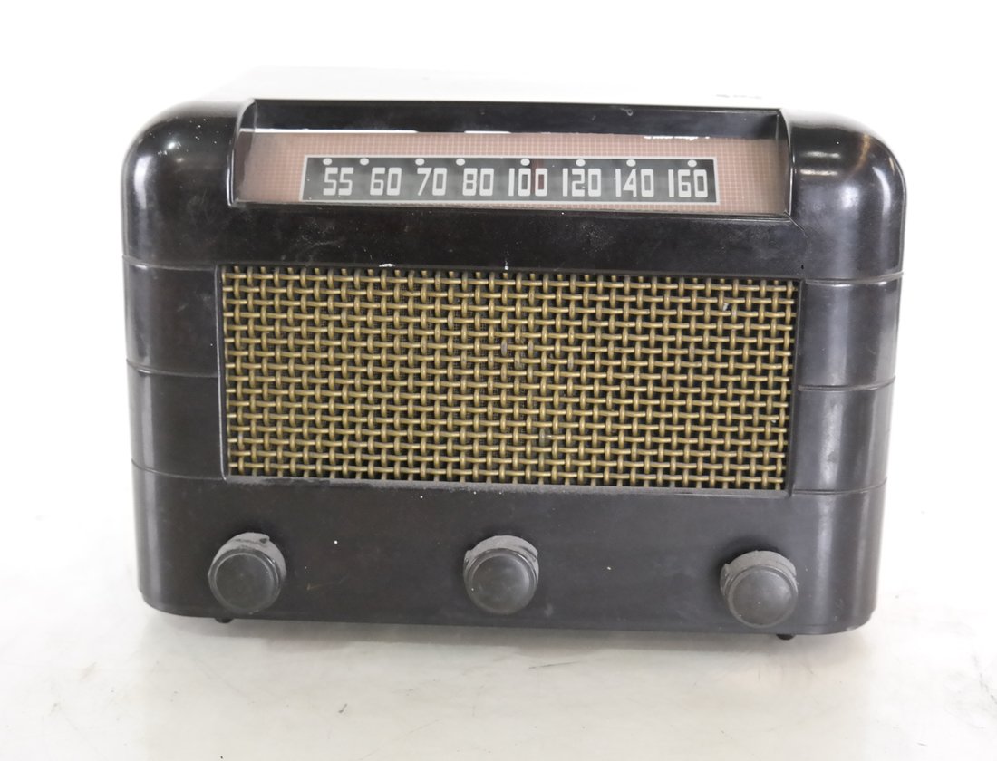 Radio: Art deco radio with brown chassis and grill. Dimensions: 12.00 " W x 8.50 " H x 7.50 "D; 