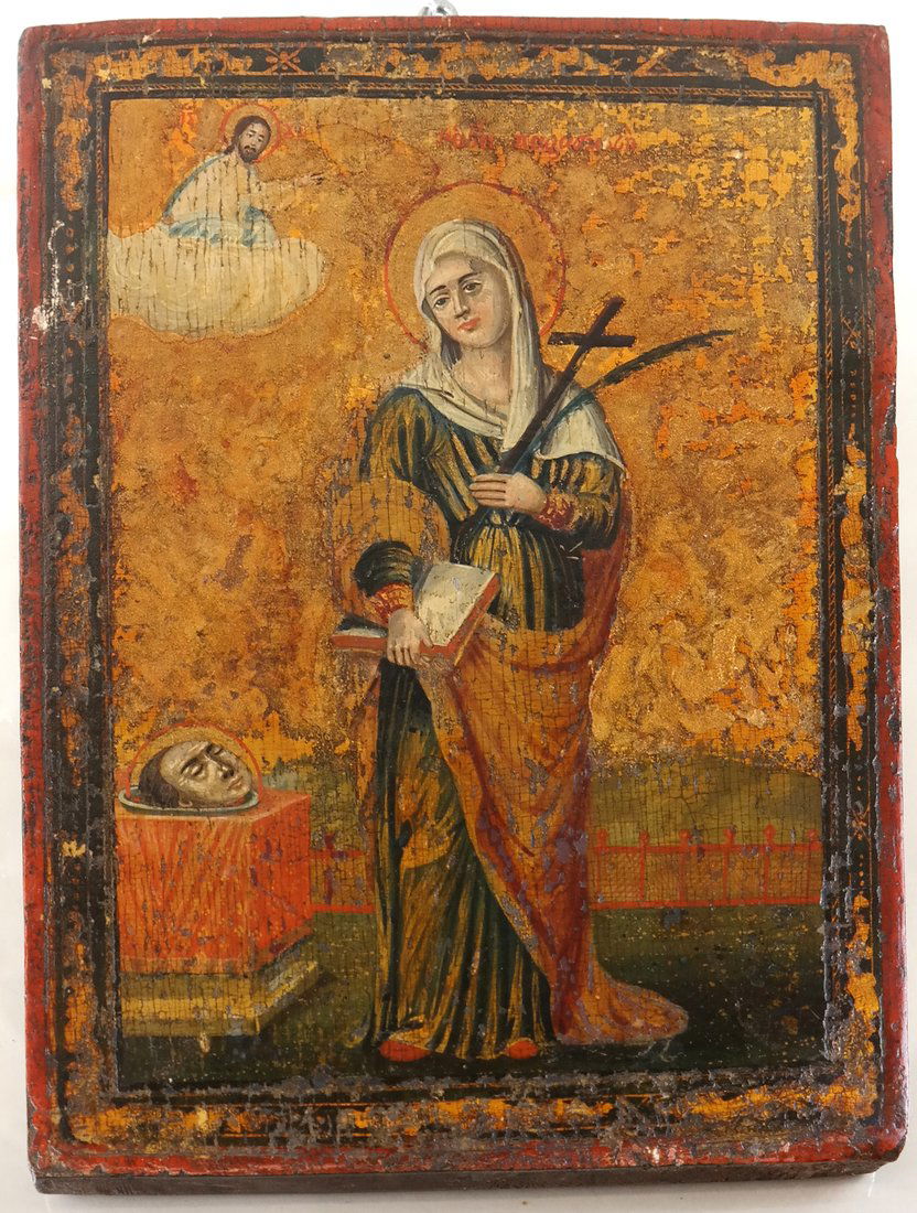Greek Icon of a Martyred Saint: Tempra and oil on panel, painted as a Green martyred saint, with palm, cross, book and beside severed head. Bears Greek inscription, the reverse with inscribed label "Agia Paraskevi". [Panel: 12" x 9
