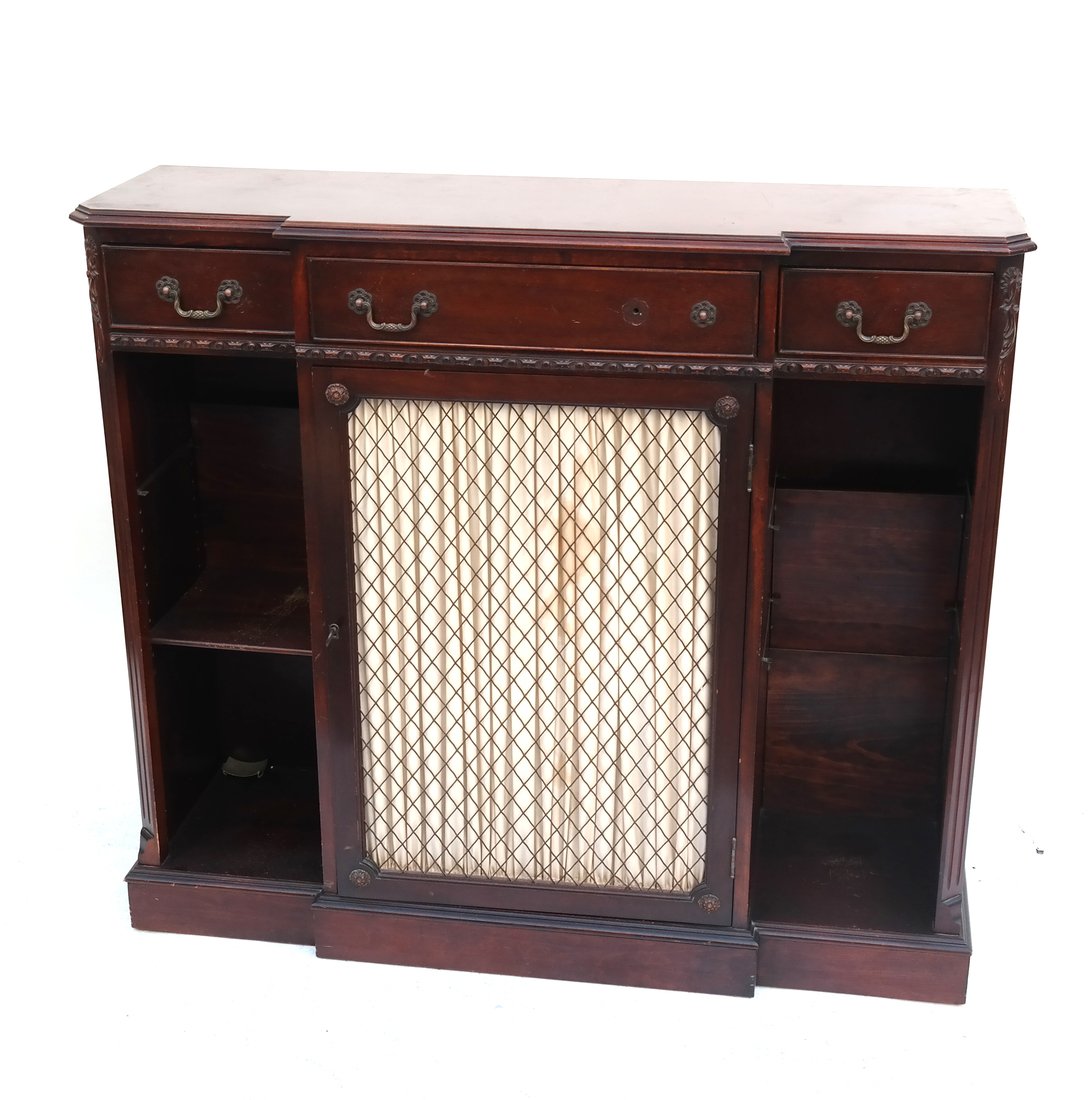 Chippendale Style Mahogany Credenza: 20th century Chippendale Style Mahogany Credenza having a grill door flanked by shelves, below three drawers. [44 1/4" W x 13 1/2" D x 39" H]. Having scratches and marks, sold as is.