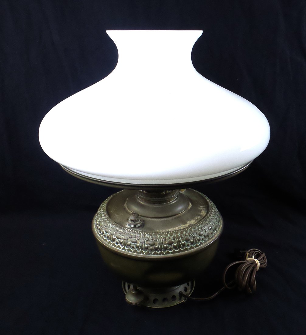 Victorian "Gone with the Wind" Lamp: "Gone with the Wind" lamp with milk glass shade. [18" H x 13" Dia]. Body is scratched and dented.