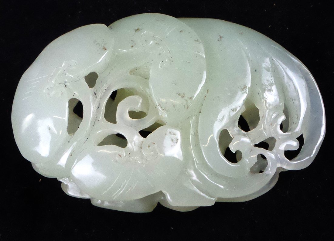 Chinese White Jade Pendant: Chinese white jade pendant, open oval with sacred figure [2 1/2" Dia]. Minor surface grime.