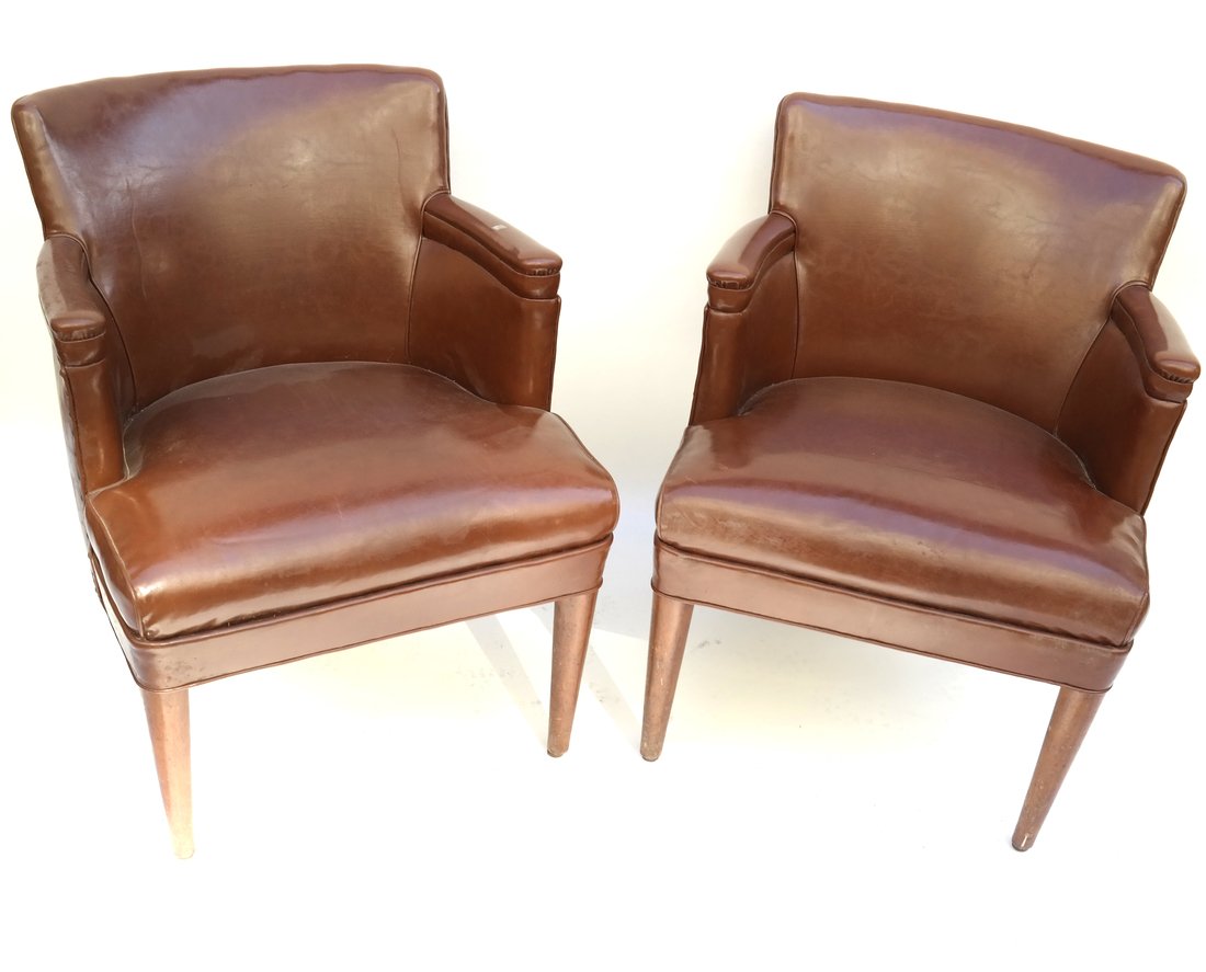 Pair of Leather Chairs: Pair of walnut framed brown leather upholstered chairs. [31" H x 23" W x 23" D; 17 1/2" H to seat]. Upholstery is worn with scuffs.