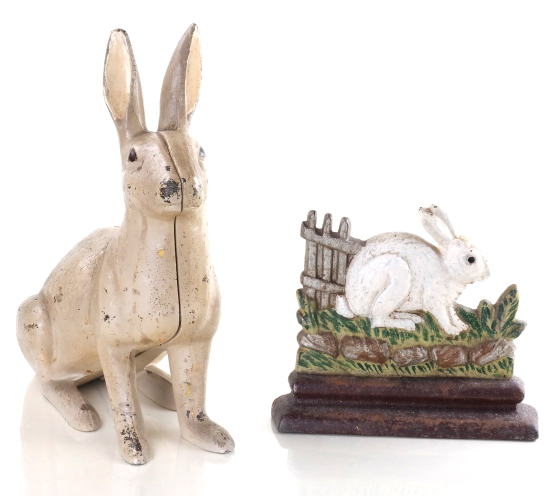 Two Painted Cast Iron Rabbits: Comprising: Rabbit by Fence doorstop by Albany Foundry, and a full-bodied Rabbit garden ornament by by Hubley Mfg. Co. [Height: 7 3/4" and 12"; Width: 8" and 10"].