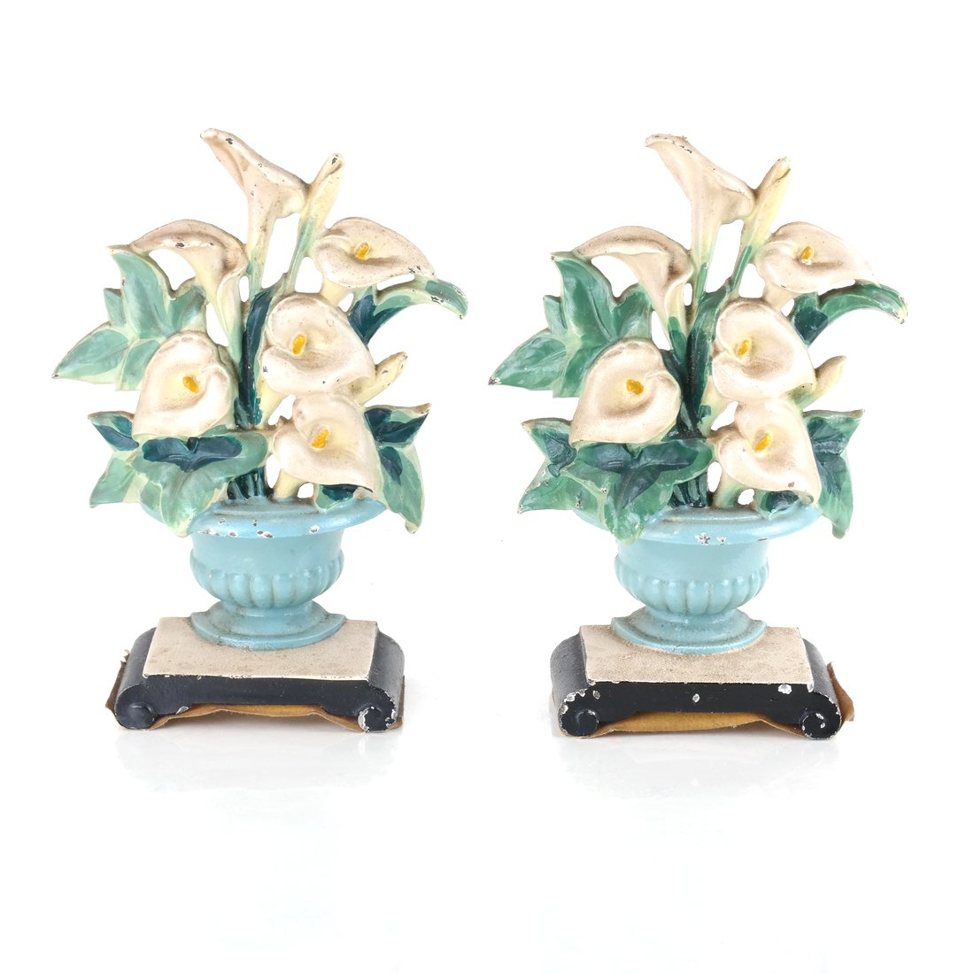 Two Identical Cast Iron Lilies in Urns Doorstops: By Hubley Mfg. Co., the reverse of each impressed "Hubley / 343 / Made in USA"; painted in colors [7 1/8" H x 5 1/4"].