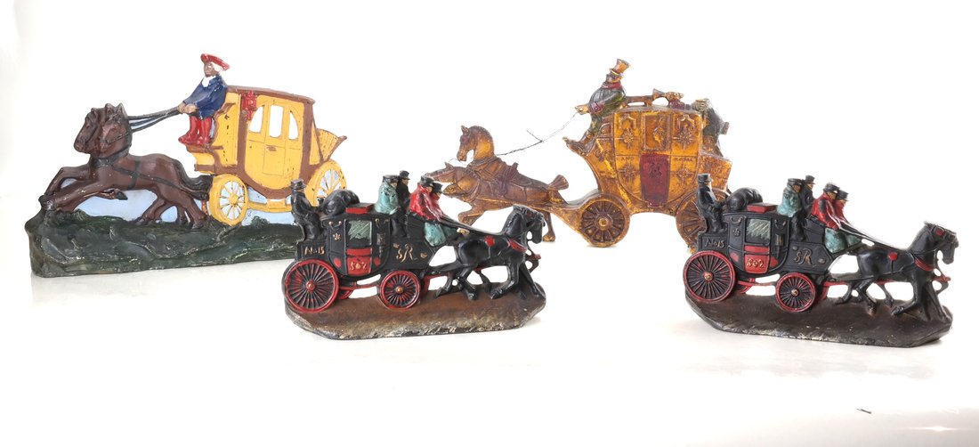 Four Painted Cast Iron Coach Doorstops: Comprising: two relief-molded Royal Mail Carriages pulled by a team of horses, by H. Howell Co., each revers impressed "Copy T., H. Howell Co. 1", a full-bodied, hollow-cast coach with driver and team