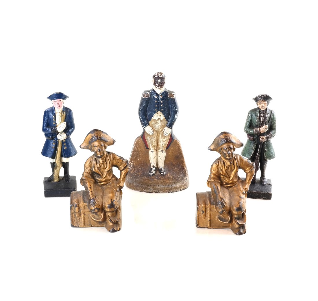 Five Cast Iron Colonial Figures: Comprising: a doorstop modeled as Major Domo, the reverse impressed "1249", two similar full-bodied, solid-cast figures of Colonial Soldiers, and two gilt-painted full-bodied, solid-cast figures of pi