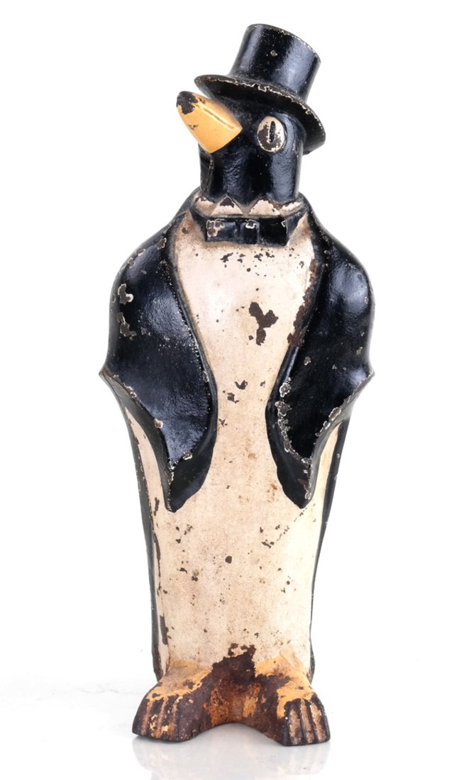 Cast Iron Penguin with Top Hat: The hollow-cast, full-bodied figure molded and painted as Penguin with Top Hat, by Hubley Mfg. Co. [ 10 1/4" H x 4" W].