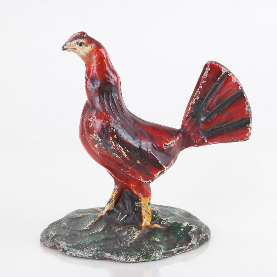 Painted Cast Iron Bird Doorstop: Modeled and painted as a Game Cock, standing on a wide base. [7" H x 5 3/8" W].