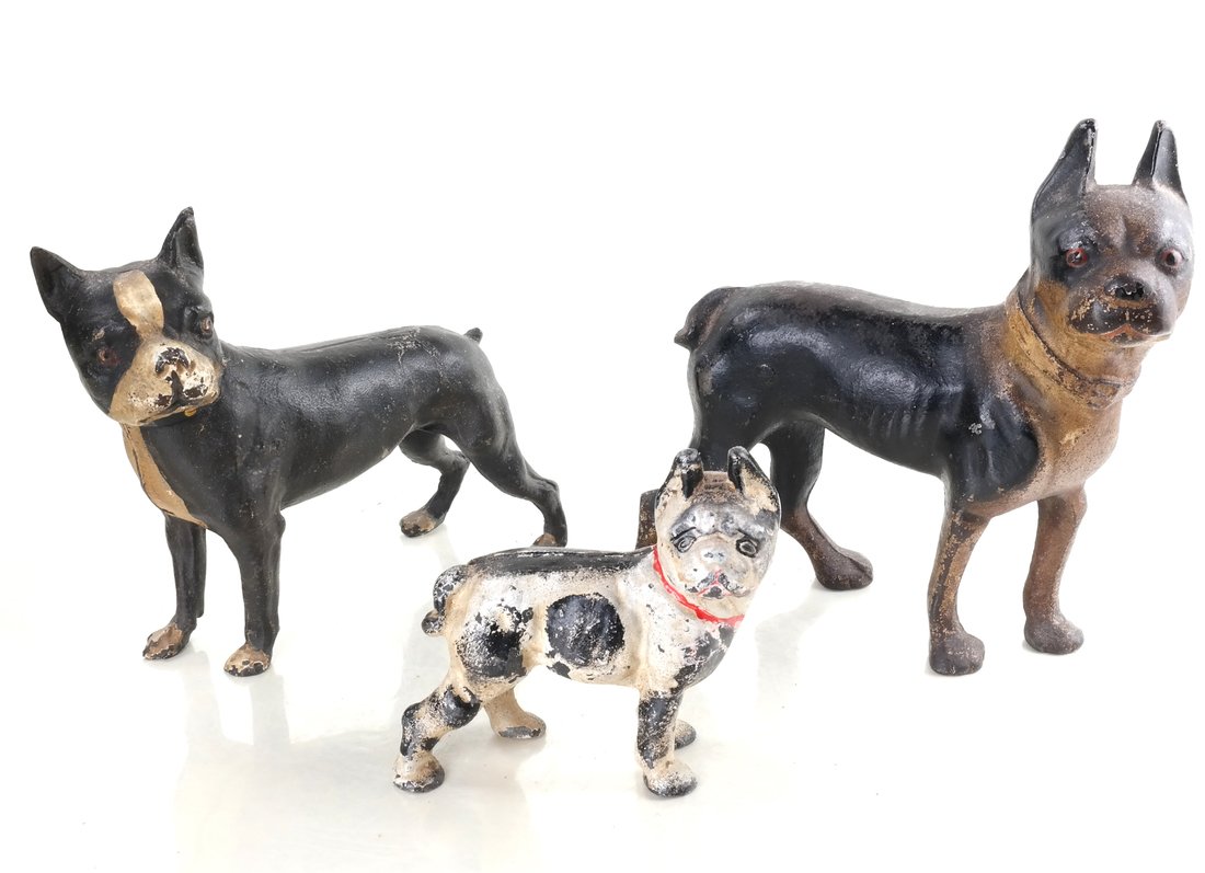 Three Cast Iron Boston Terrier Bulldogs: Probably by Hubley Mfg. Co., or National Foundry, each apparently unmarked, and hollow-cast, full-bodied figures, modeled and painted as three various small dogs, including two gazing right and one ga