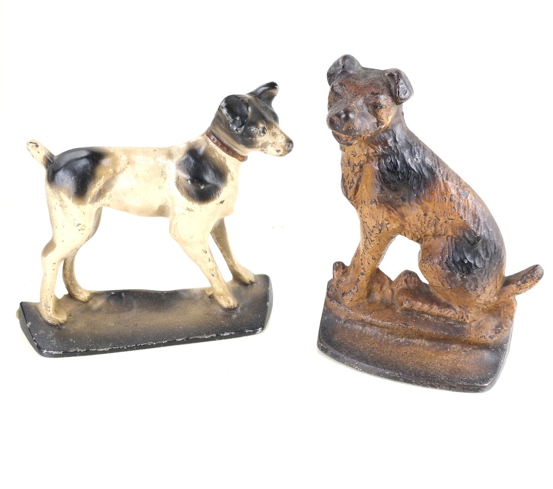 Two Painted Cast Iron Terriers: The two doorstops by probably by Creations Co., comprising: Seated Wirehaired Terrier, the reverse partially impressed " Cop rt 1930 C Co __9", and Terrier on Base, apparently unmarked, [Sizes from 8 