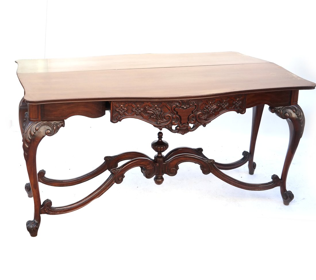 George III Style Mahogany Console: 20th century, the shaped apron fitted with a blind drawer, with scrolling X-form stretchers, [H 31" x L 62" x D 21"], some light wear overall.