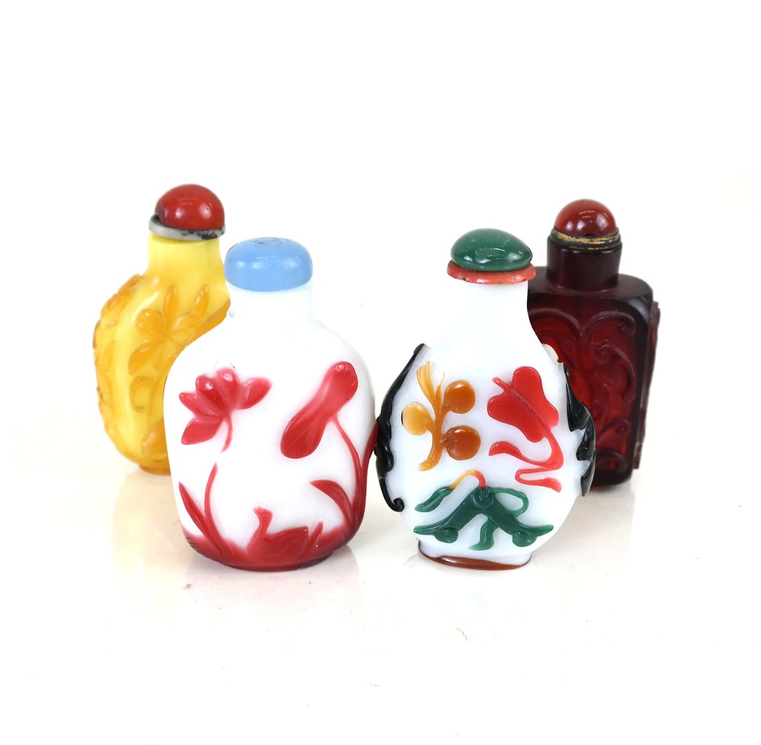 Four Chinese Peking Glass Snuff Bottles: Each fitted with stoppers, and one fitted with a spoon, [H 3" to 3 1/4" x W 1 2/4" to 2"], one white ground glass body with approx. 1/4" chip at neck, all with minor chips and losses, three stoppers l