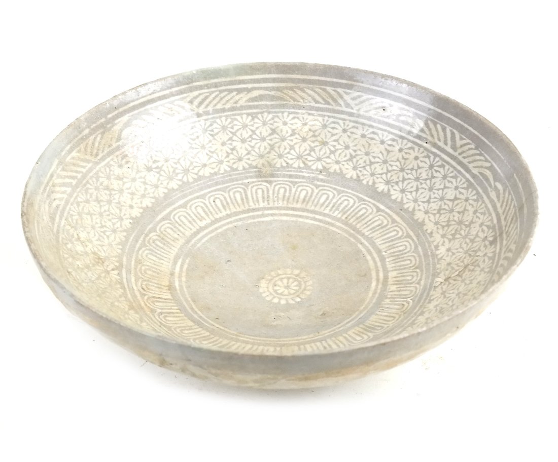 Early Chinese Pottery Bowl: Probably Ming dynasty. With underglaze stylized foliate decoration. [2 1/2" H x 7 1/2" Dia]. Some wear overall.