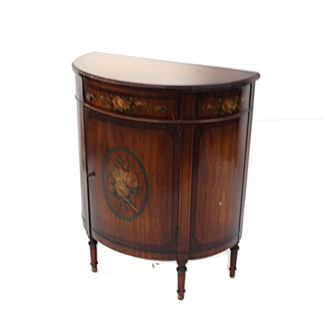 Louis XVI-Style Demilune Cabinet: Louis XVI-style diminutive demilune cabinet. Featured hand-painted floral decor, fitted with one drawer above one door. [31" H x 26" W x 13" D]. Scuffs and craquelure.