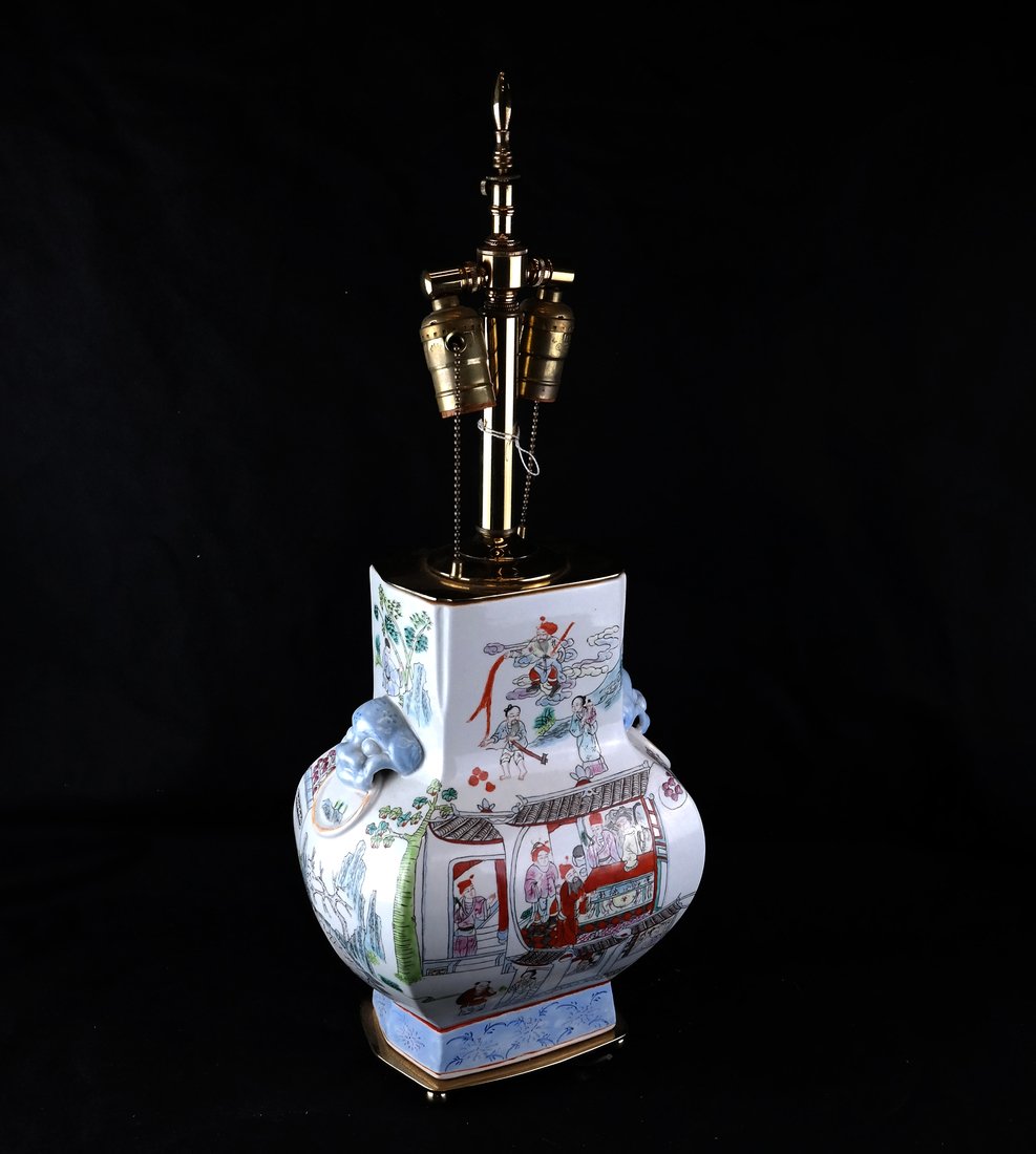 Chinese Porcelain Vase Mounted As a Lamp: Chinese Porcelain Vase molded with Lion's mask handles, painted with landscape scenes, later mounted as a Table Lamp, [H to top of Vase 13"; W 9 1/2"; D 7"], Drilled and fitted as a table lamp, some m