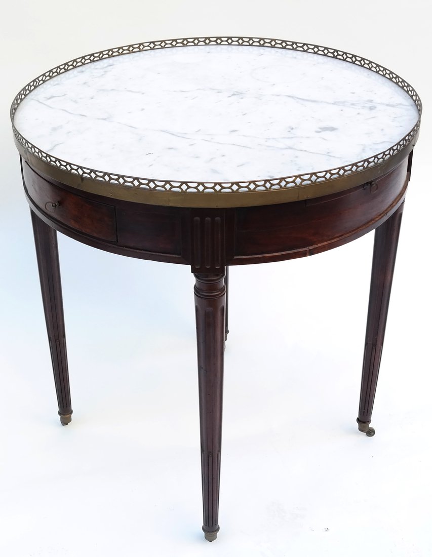 Louis XVI-Style Bouillotte Table: Louis XVI-style marble top bouillotte table with a reticulated brass gallery. [28" H x 26" Dia.]. Needs restoration.