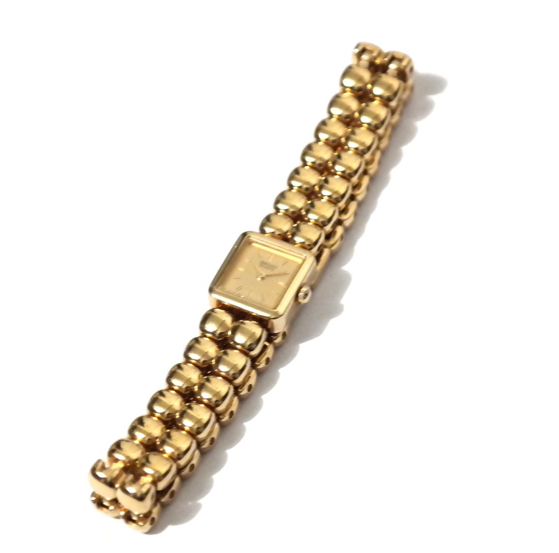 Seiko Quartz Lady's Gilt Metal Watch: With square gilt dial, with Seiko case, [L 7 1/2", W 1/2"]