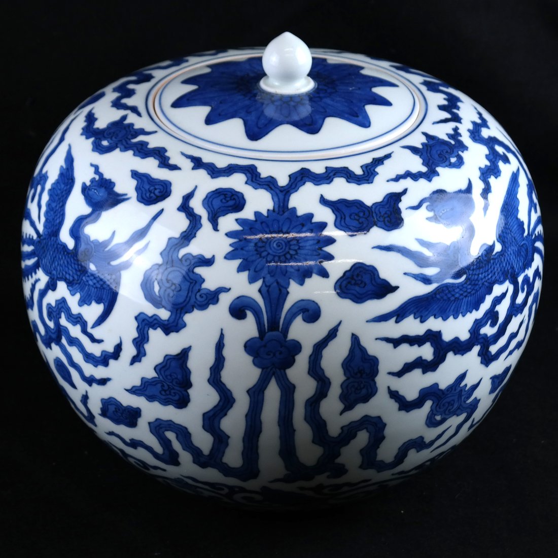 Asian-Style Blue & White Ginger Jar: Asian-style porcelain blue and white decorated ginger jar with lid. Incised mark on underside of base. [10" H x 10 1/2" Dia]. Minor surface grime.
