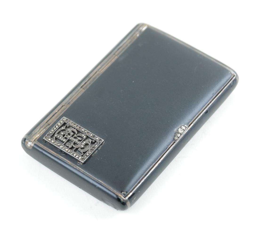 French Jeweled Compact: Black base with a gold tone interior and a sleek jeweled applique.