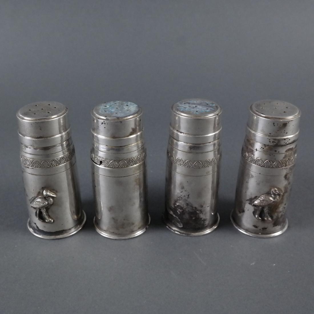 Four .900 Standard Silver Casters: Four .900 Standard Silver Casters.[3" H x 1 3/8" Dia., Total weight approx: 8 ozt.]. Well worn.
