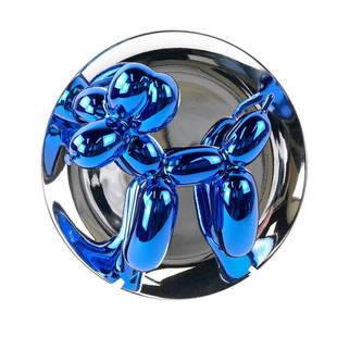 Jeff Koons, "Balloon Dog (Blue)" - Porcelain Scupture: Jeff Koons (American, born 1955). Fine porcelain sculpture depicting a balloon dog accomplished in metallic blue glaze upon a silver luster glaze plate. Verso retains original printed paper label issu