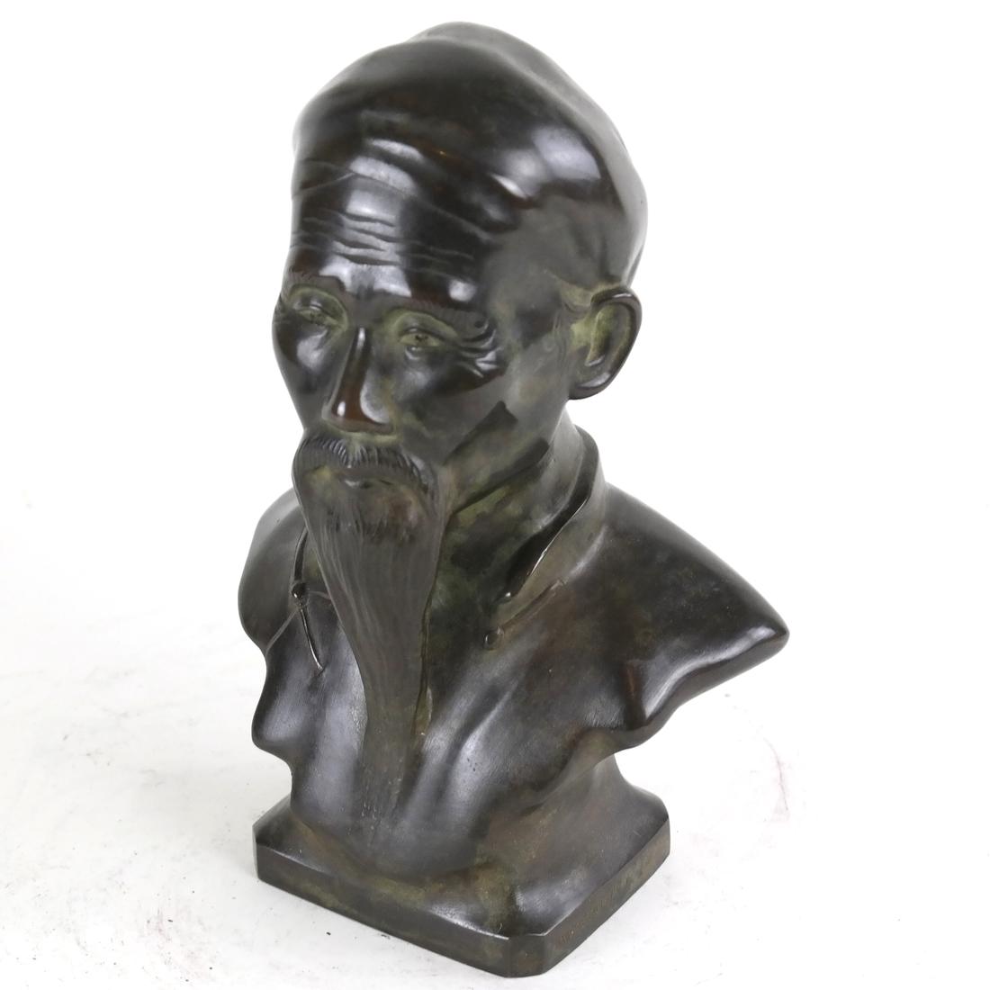 Bronze Figure Of A Man: Bronze figure of a young man. Marked on base rim: "Made in French Indochina".[7 1/2" H].