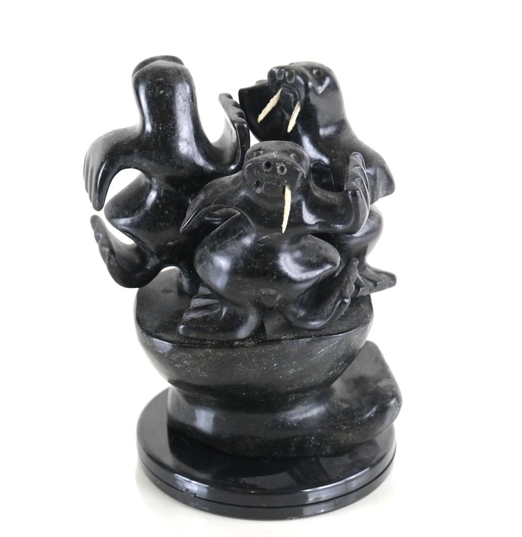 Canadian Inuit Sculpture: Three walruses on a base. Each Walrus is removable.[5 1/2" H]. One missing a tusk.