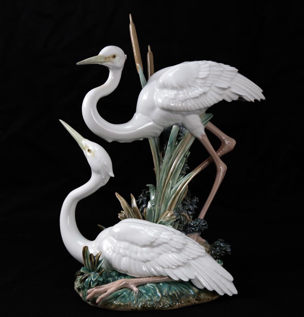 Lladro "Marshland Mates" Cranes Group: Cranes standing among cattails. No 5691 [11"].Overall good condition; no chips; no cracks; no repairs.