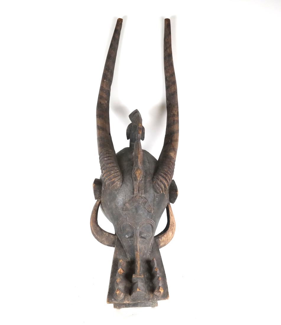 african Tribal Wood Mask: Tribal wood mask with antlers. [35 1/2" H].