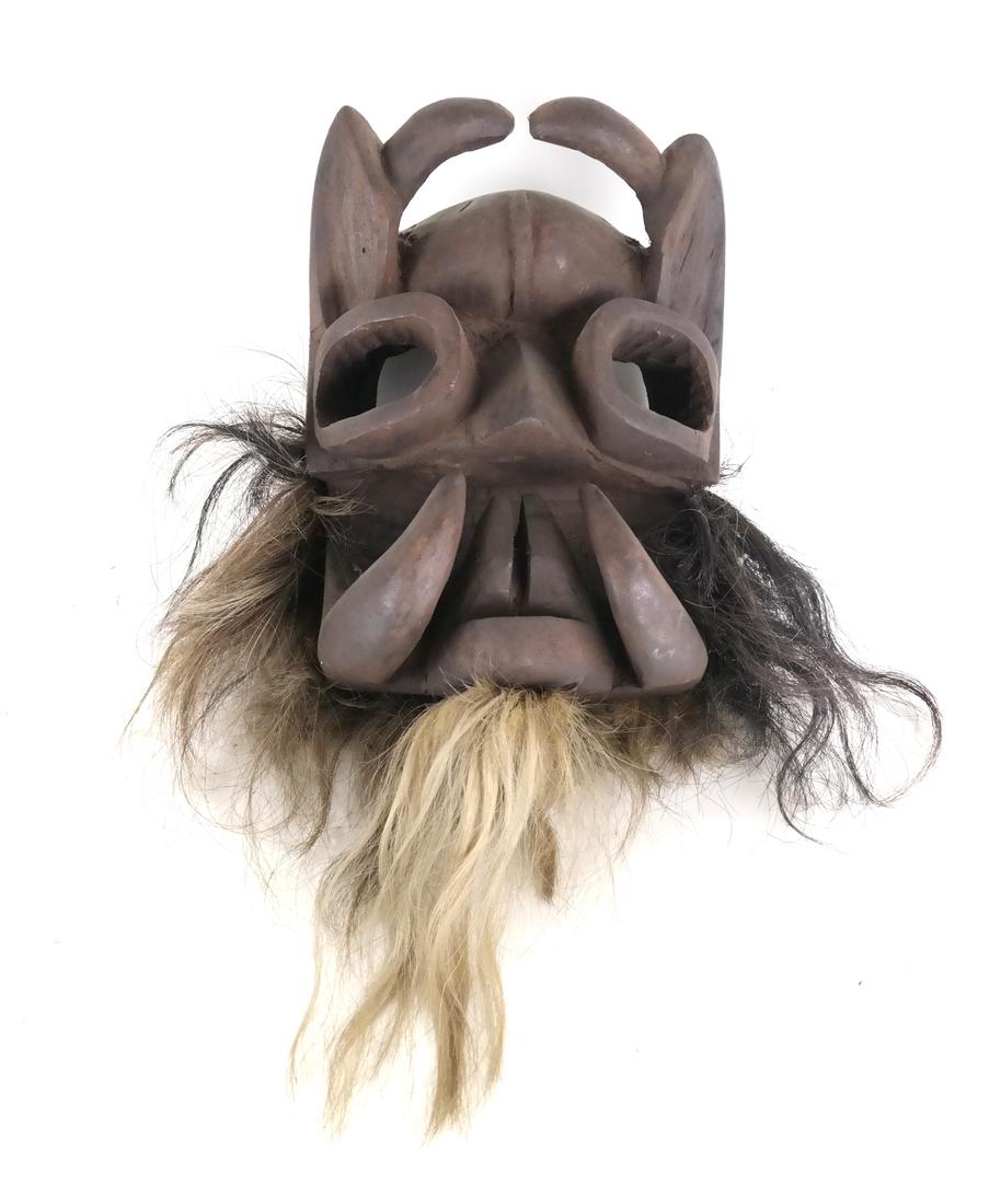 Tribal Wood Mask: Tribal wood mask with hair. [11" x 8"].