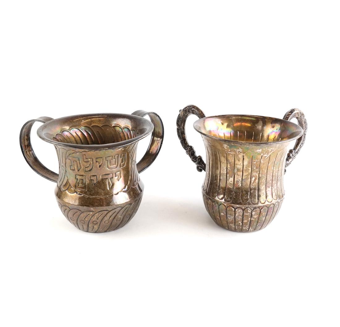 Two Sterling Judaic Hand Washing Vessels: Each decorated, one inscribed in Hebrew with the blessing over washing the hands, the other inscribed on underside of base: "All our love, Cindy, David, Craig and Jeremy". Both marked 925. [4 1/2" H x
