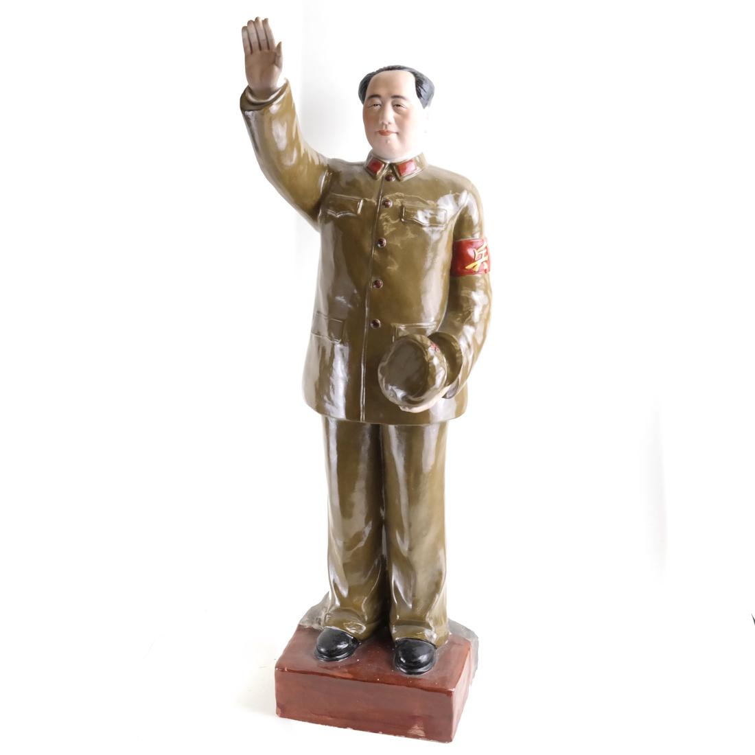 Chinese Glazed Porcelain Mao Figure: Chinese Cultural Revolution glazed porcelain figure of a young Mao standing wearing his uniform and waving. [3" H x 9" W x 8" D].