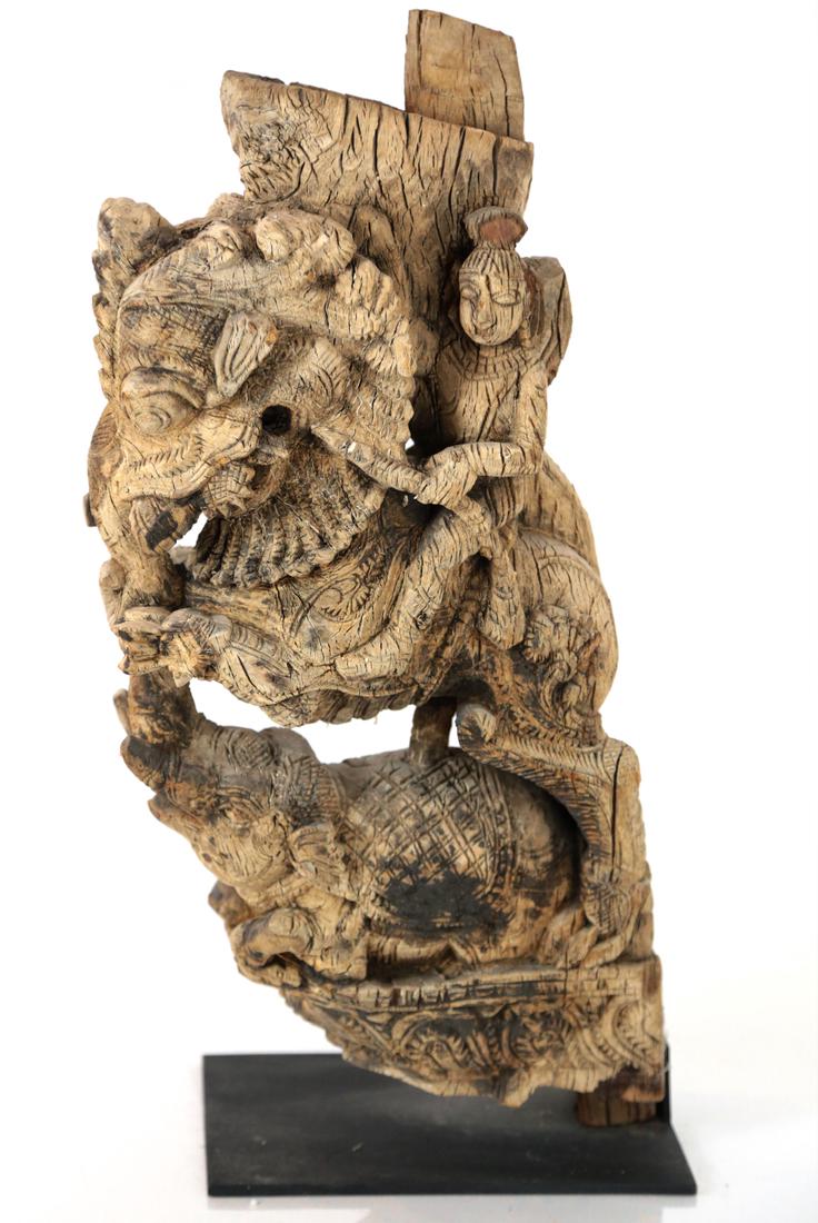 Indonesian Carved Fragment: Indonesian carved fragment depicting a warrior on horseback. [23" x 7"].