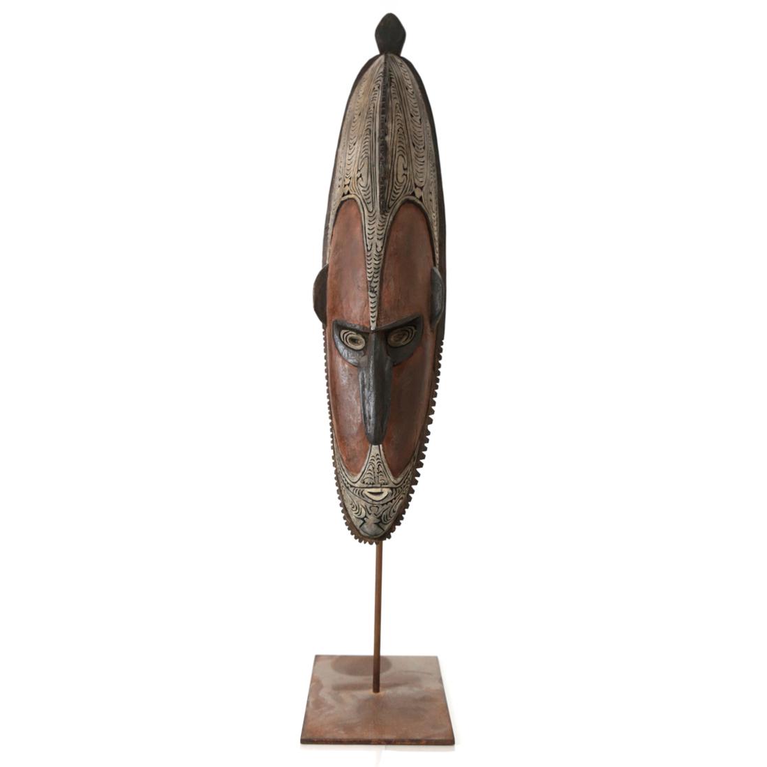 African Carved Wood Mask: Vintage painted carved wood African mask on custom base. [Mask: 19 1/2" H; overall: 25" H].