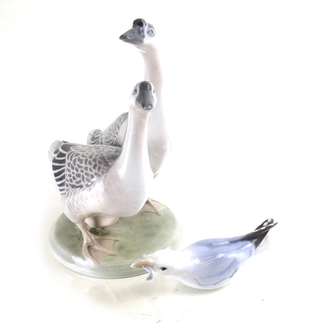 Danish Bird anb Royal Copenhagen Geese Porcelain: Comprising a Royal Copenhagen goose group and a Bing & Grundel seagull, under glaze blue and green printed factory marks. [8 1/2" H x 8" L; 2" x 5 1/2"].