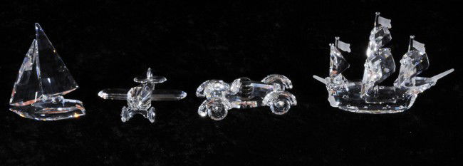 4 Swarovski Crystal Sculptures of Transportation M: 4 Swarovski Crystal Sculptures of Transportation Modes. 3 Masted Ship, Sail Boat, Airplane & a Car. All Have Boxes
