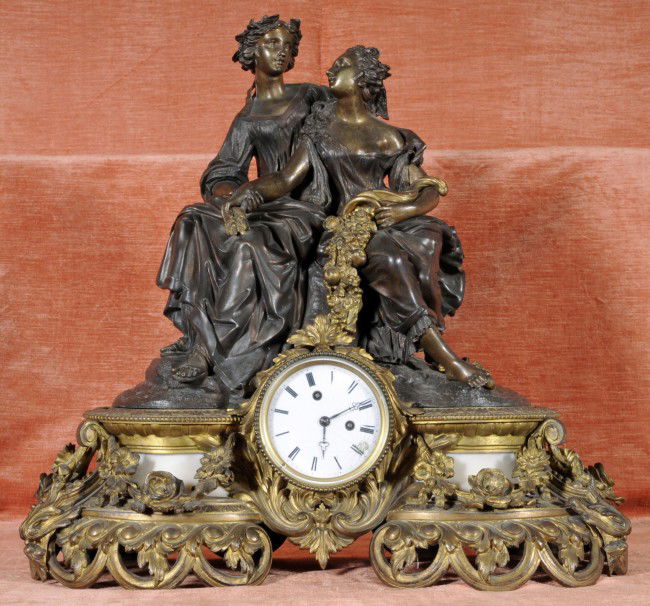 19th C. French Bronze Alabaster Mantel Clock. Fig: 19th C. French Bronze Alabaster Mantel Clock. Figural Decoration. Alabaster Panel Base. 23" H x 25" W x 10" D.