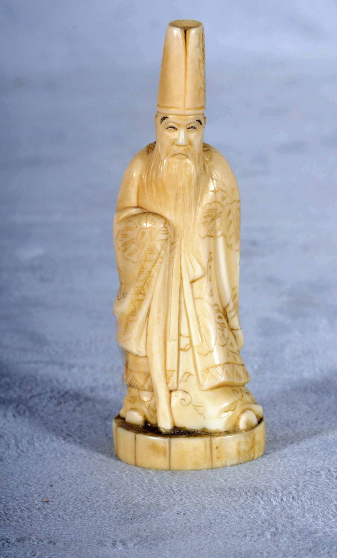 CHINESE CARVED IVORY FIGURE OF A WISEMAN WITH A TA: CHINESE CARVED IVORY FIGURE OF A WISEMAN WITH A TALL HAT AND A LONG BEARD. SIGNED ON THE BOTTOM. 3 3/4" H.