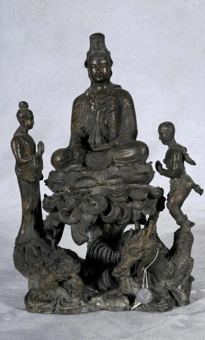 THAILAND BRONZE STATUE OF THREE FIGURES. A SEATED: THAILAND BRONZE STATUE OF THREE FIGURES. A SEATED BUDDHA AND TWO FIGURES ON THE SIDE STANDING ON DRAGON FISH. 9 7/8" H X 7" W.