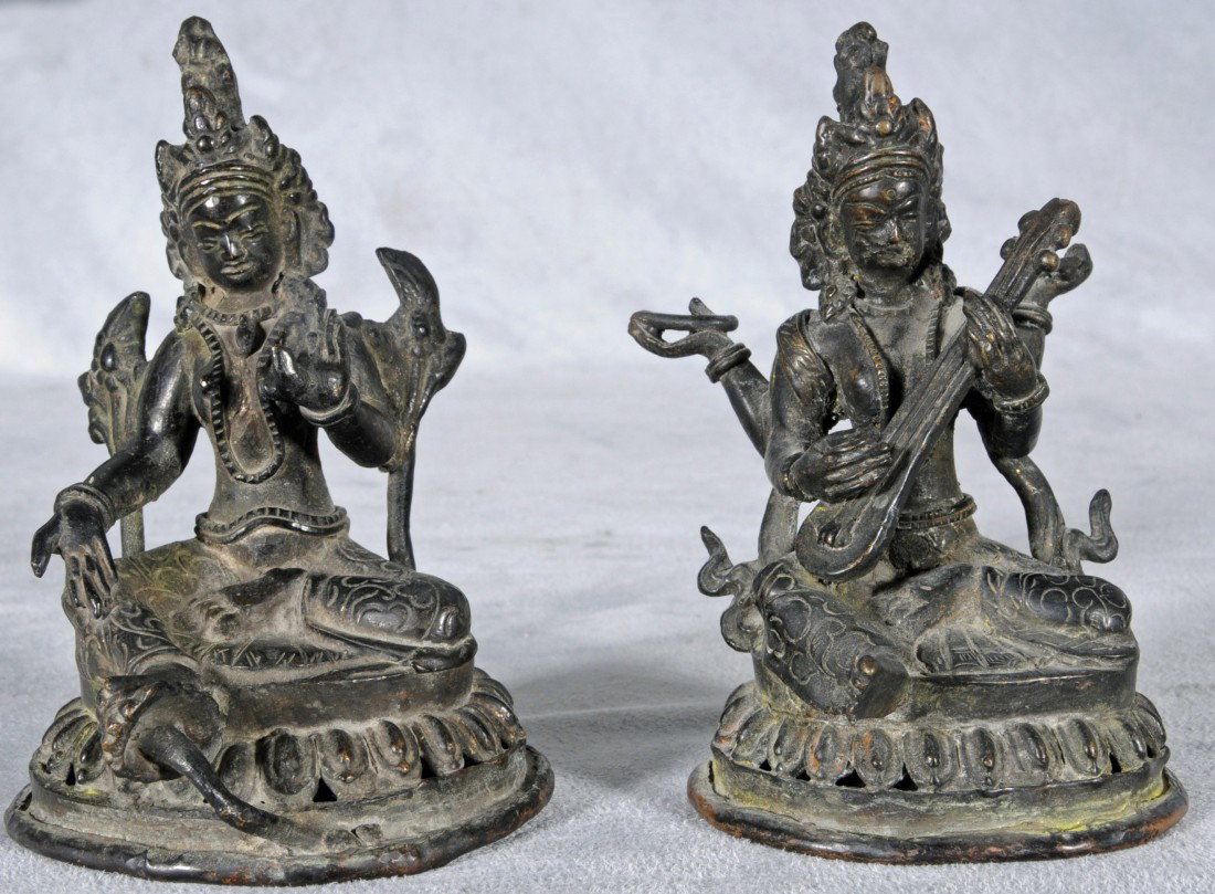 2 NEPALESE SMALL BRONZE BUDDHAS. ONE IS PLAYING A : 2 NEPALESE SMALL BRONZE BUDDHAS. ONE IS PLAYING A MUSICL INSTRUMENT AND THE OTHER HAS HIS PALMS OUT. COPPER BOTTOMS INTACK. 4 5/8" H.