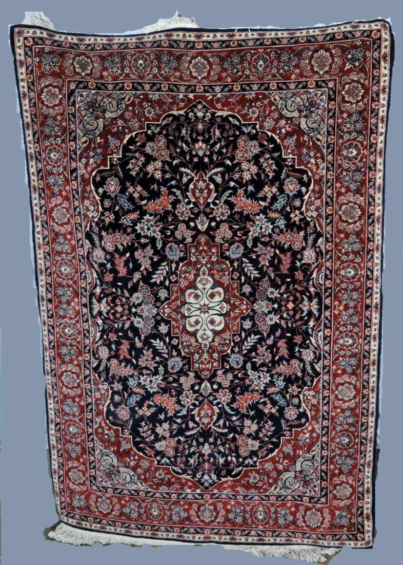 BLUE KASHAN THROW RUG. APP. 4' X 6'. MULTI-COLORED: BLUE KASHAN THROW RUG. APP. 4' X 6'. MULTI-COLORED FLORAL DECORATION W/ A RED BORDER. 4' X 6'.