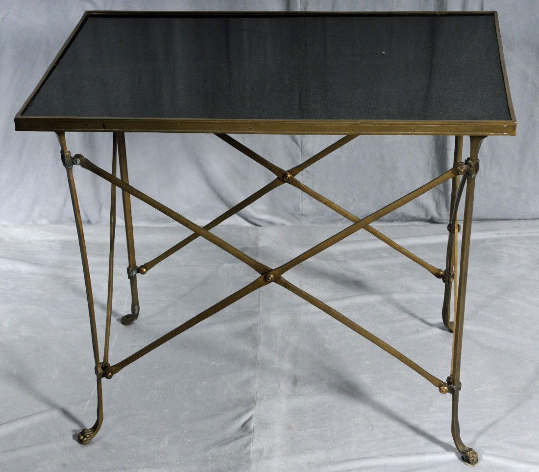 FRENCH BRASS & MARBLE END TABLE. SHAPED BRASS FRAM: FRENCH BRASS & MARBLE END TABLE. SHAPED BRASS FRAME RESTING ON PAW FEET. BLACK MARBLE TOP. ONE SLAT MISSING ON SIDE. 26 1/2" H X 30 1/8" W X 19 1/8" D.