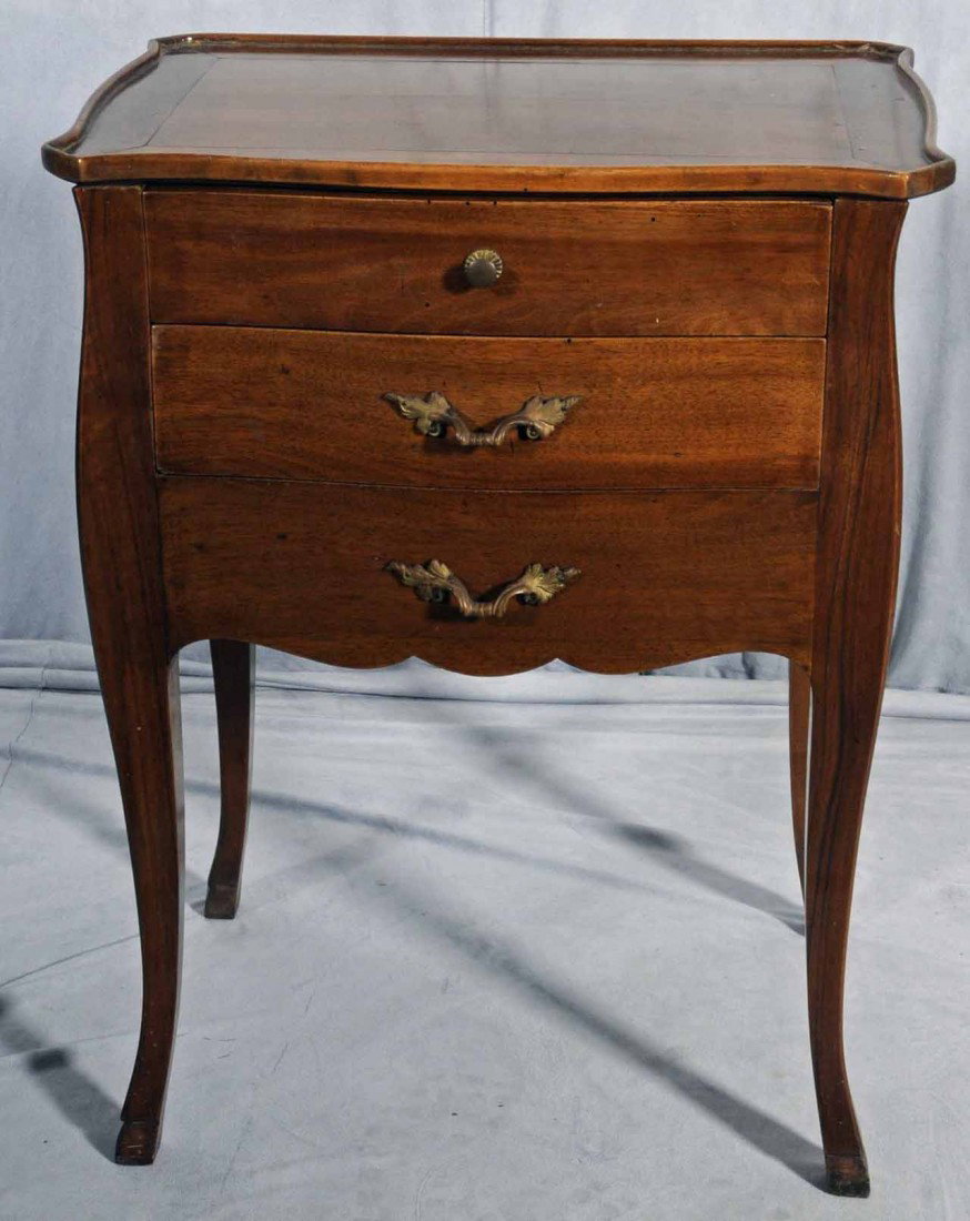 ANTIQUE FRENCH PROVENCIAL STYLE PETITE COMMODE. WAL: ANTIQUE FRENCH PROVENCIAL STYLE PETITE COMMODE. WALNUT W/ A SLIDING TOP AND WRITING SURFACE, SINGLE DRAWER IN THE FRONT AND A DRAWER ON THE RIGHT SIDE. CABRIOLE LEGS. 27 1/2" H X 21" W X 14 1/4" D.