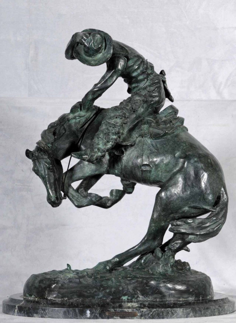 BRONZE SCULPTURE OF A HORSE & RIDER. ENTITLED "WOO: BRONZE SCULPTURE OF A HORSE & RIDER. ENTITLED "WOOLY CHAPS." THIS IS A FOUNDERS AUTHORIZED EDITION #2/100. SIGNED AFTER FREDERIC REMINGTON. MARBLE BASE. 24" H X 19 1/2" w x 14"