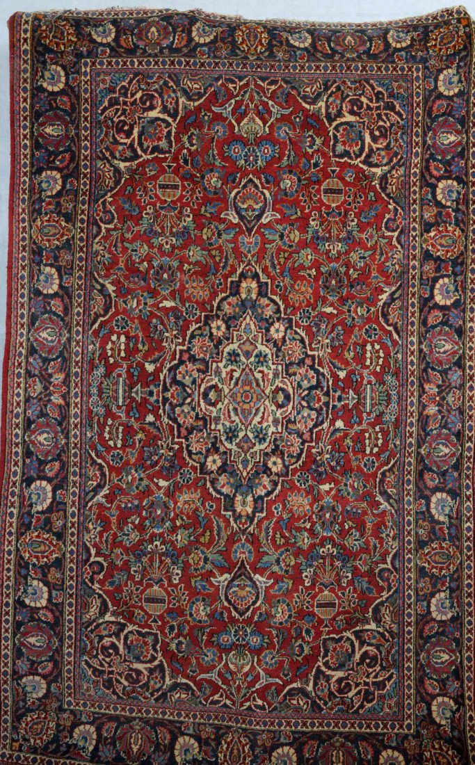 RED KASHAN THROW RUG. APP. 4' 6" X 7'. MEDALLION : RED KASHAN THROW RUG. APP. 4' 6" X 7'. MEDALLION CENTER WITH MULTI-COLORED FLORAL FIELD. 4' 6' X 7'.
