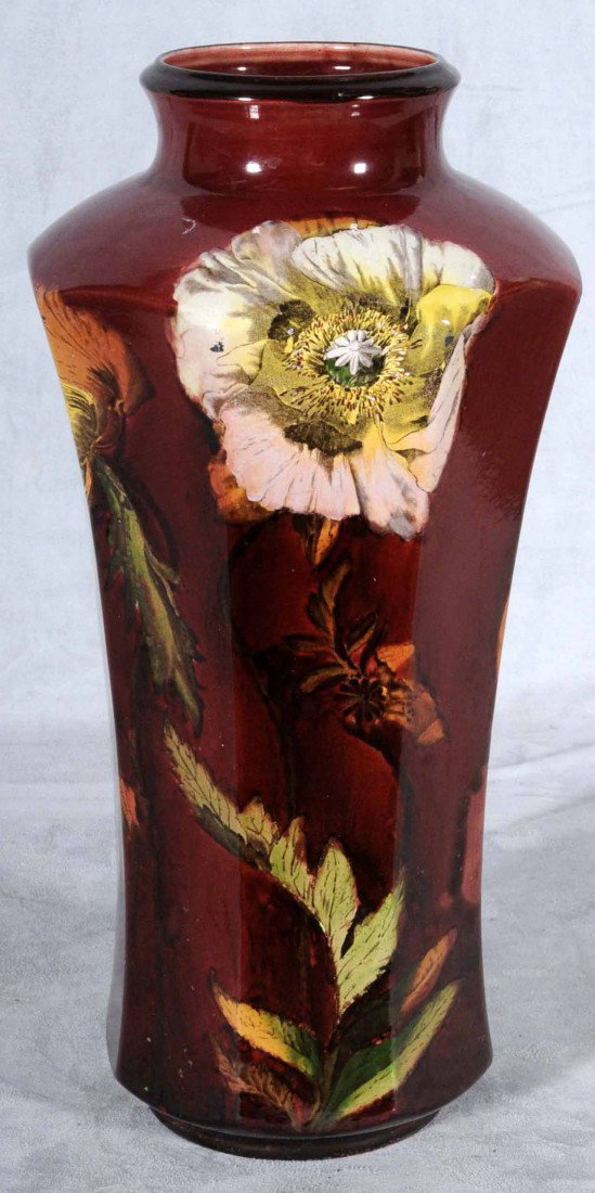 ENGLISH CERAMIC BURGUNDY COLOR VASE. MULTI-COLOR F: ENGLISH CERAMIC BURGUNDY COLOR VASE. MULTI-COLOR FLORAL DECORATION. MARKED BURMESE WARE ENGLAND. 16 1/2" H X 8 1/2" SQ.